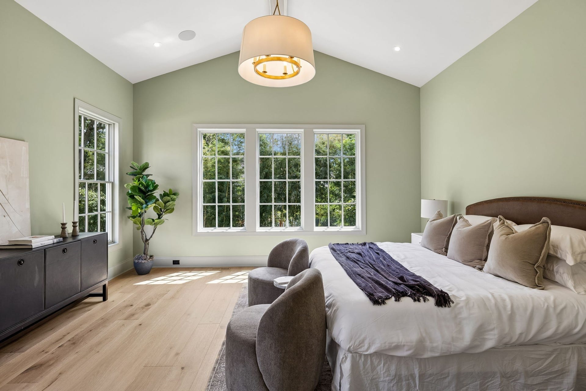 1133 Maplehurst Ln, Nashville, TN 37204 Another view of the impressive primary suite highlights the vaulted ceiling, exposed beam detail, oversized windows, and generous room for a sitting area.
