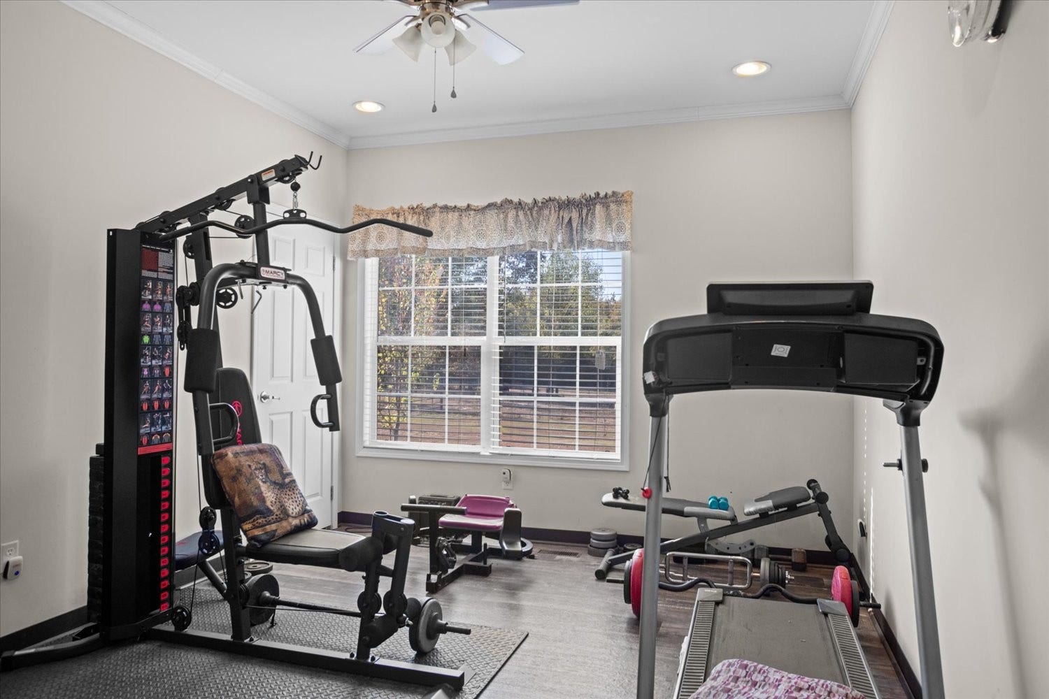 Guest bedroom with walk-in closet used as a fitness studio