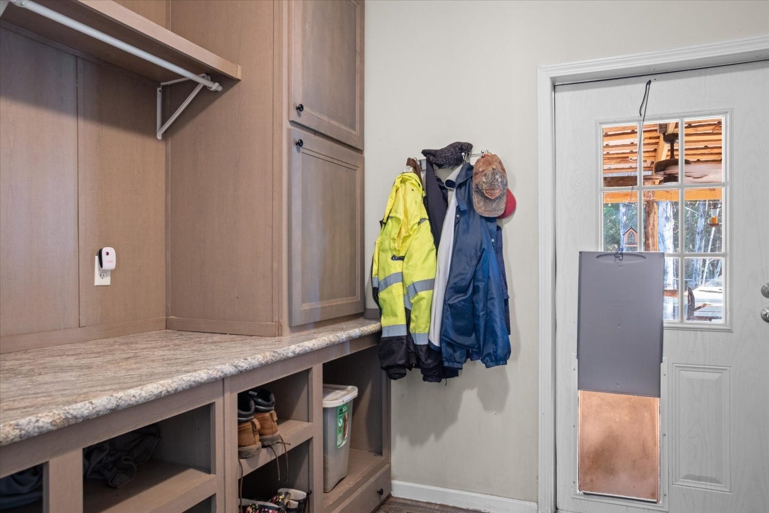 Dreamy laundry room with lots of cabinets and built-ins