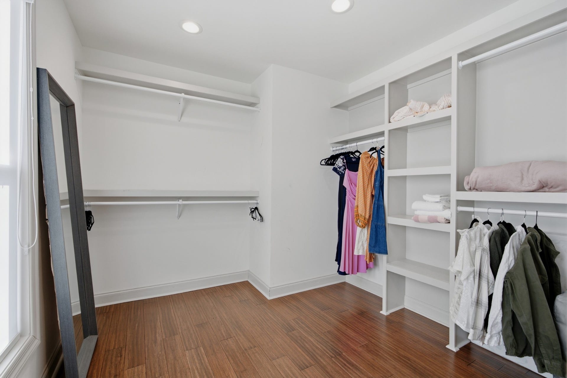 The expansive walk-in closet pairs valuable storage with built-ins for effortless organization.