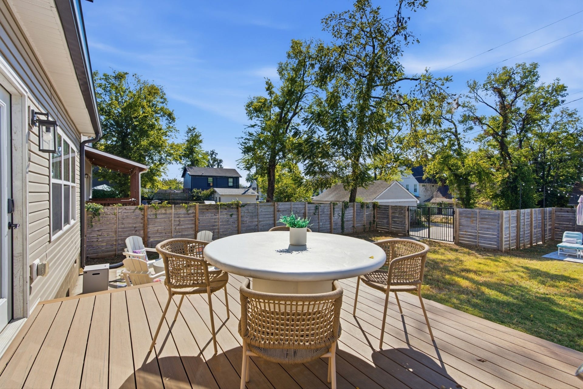 Outdoor living gets a fresh upgrade with a brand-new elevated deck and two separate patio spaces ready to enjoy.