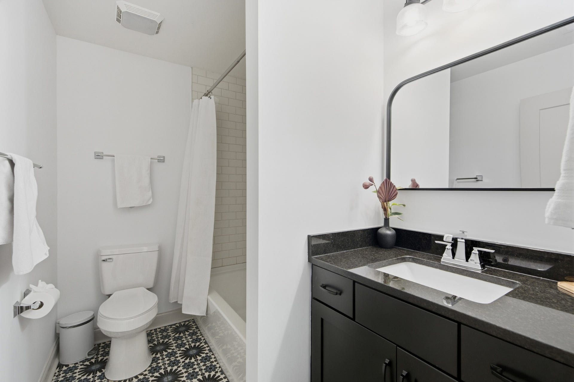 Chic tile brings a playful design moment to this full bath, conveniently serving the upstairs level.