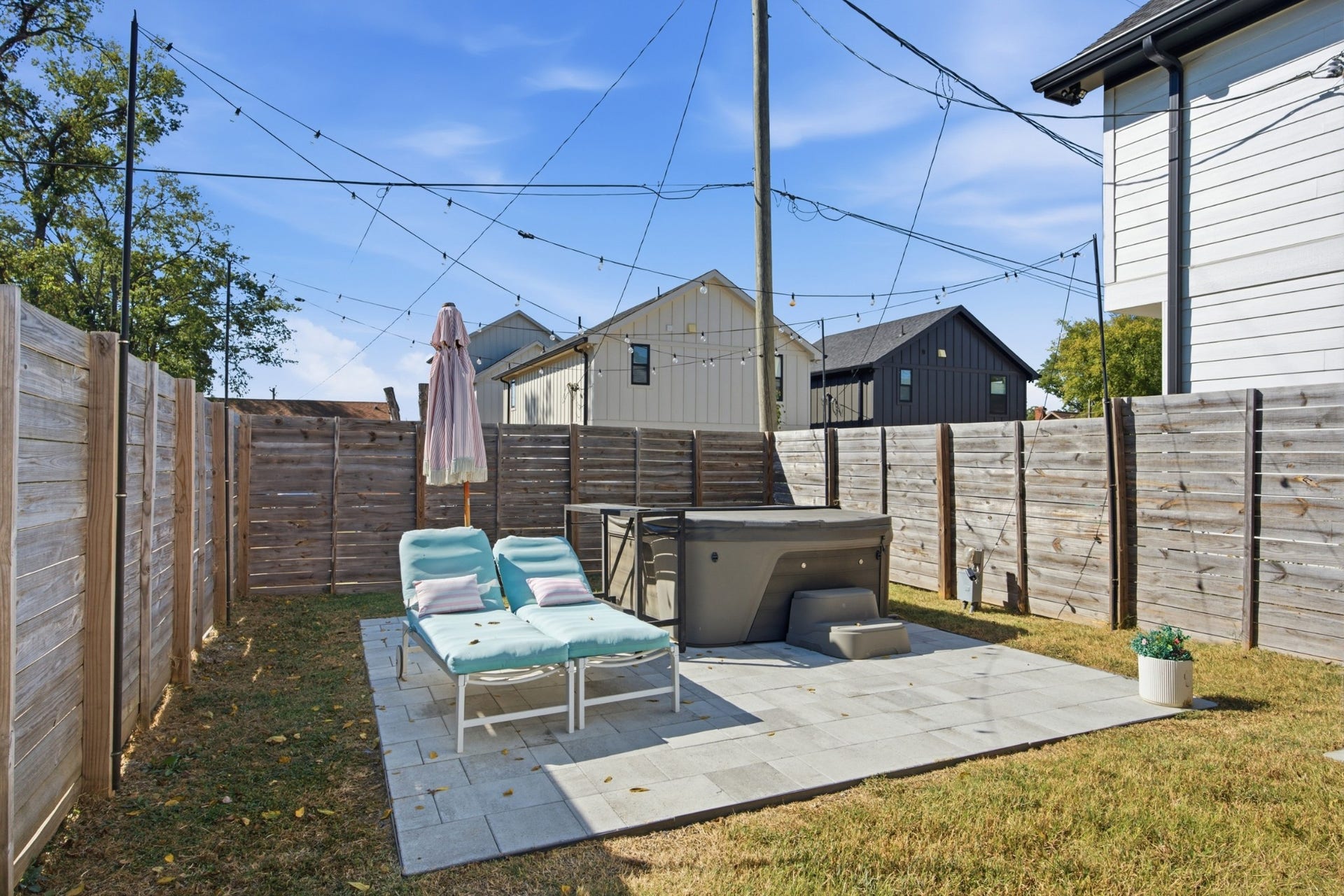 From lounging on the patio to soaking in the hot tub, the backyard is made for slowing down and staying awhile
