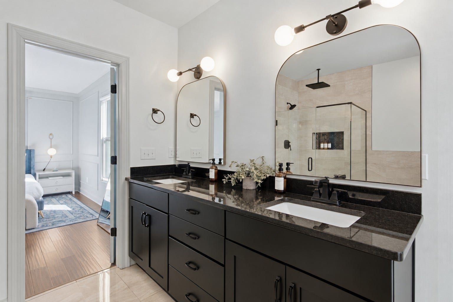 The generous double-sink vanity offers plenty of space to streamline morning routines.