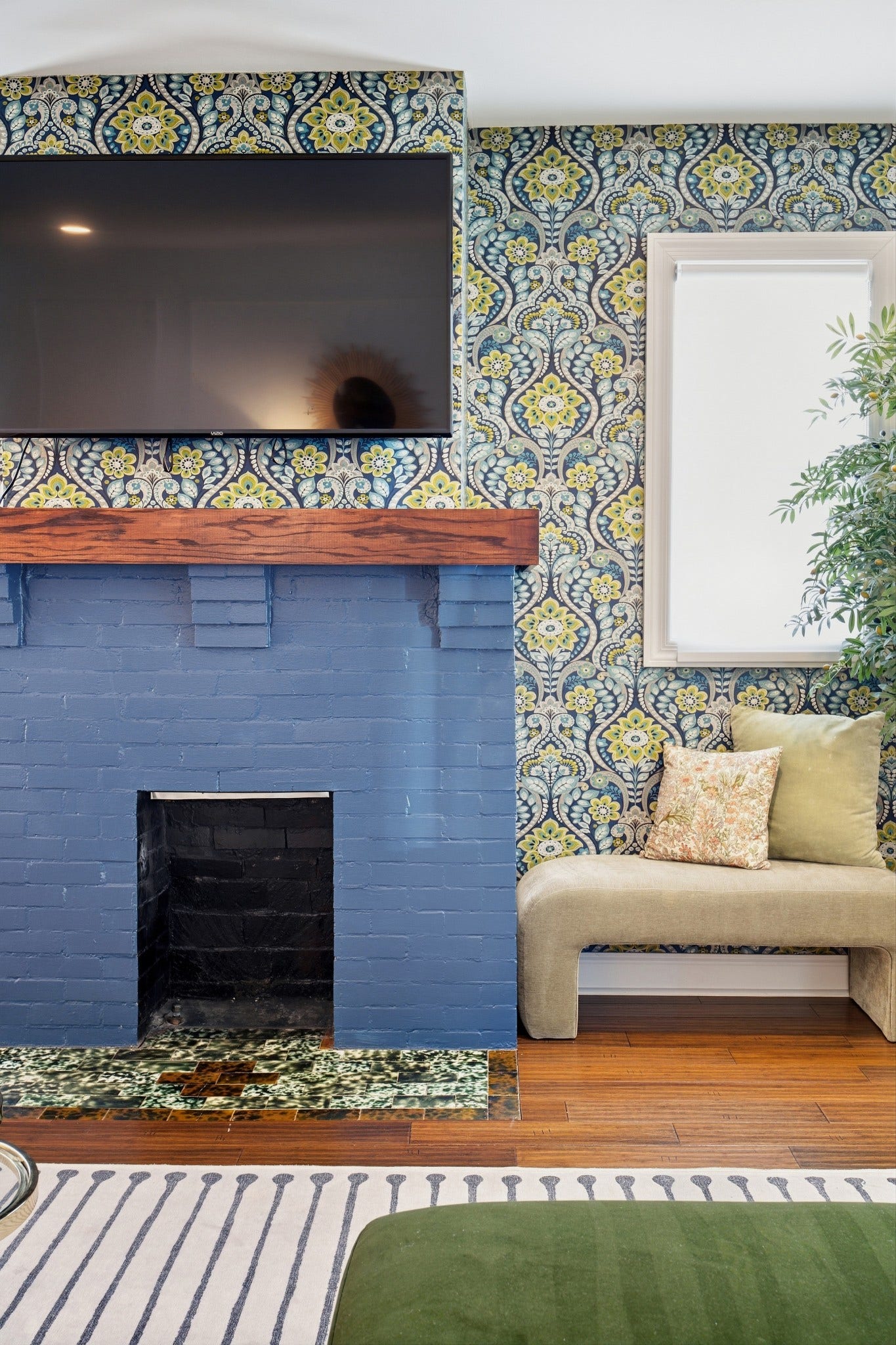 The decorative fireplace brings an architectural moment to the space.