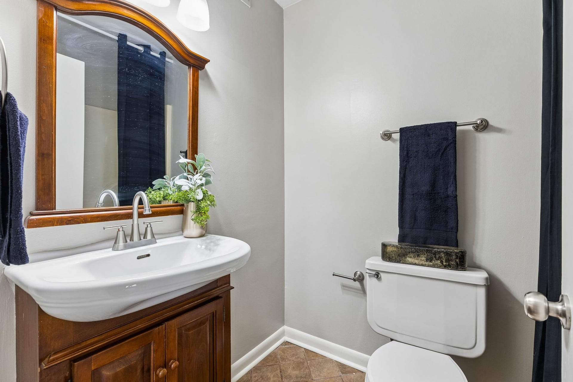 The hall bath has tiled flooring and updated with a vessel sink & vanity.