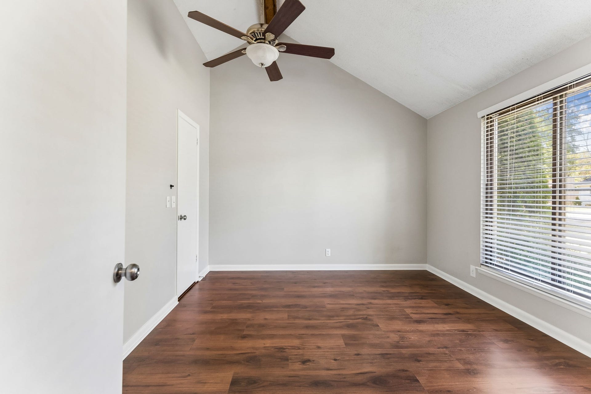 The owner's suite has a vaulted ceiling, remote controlled ceiling fan, walk-in closet and private full bath.