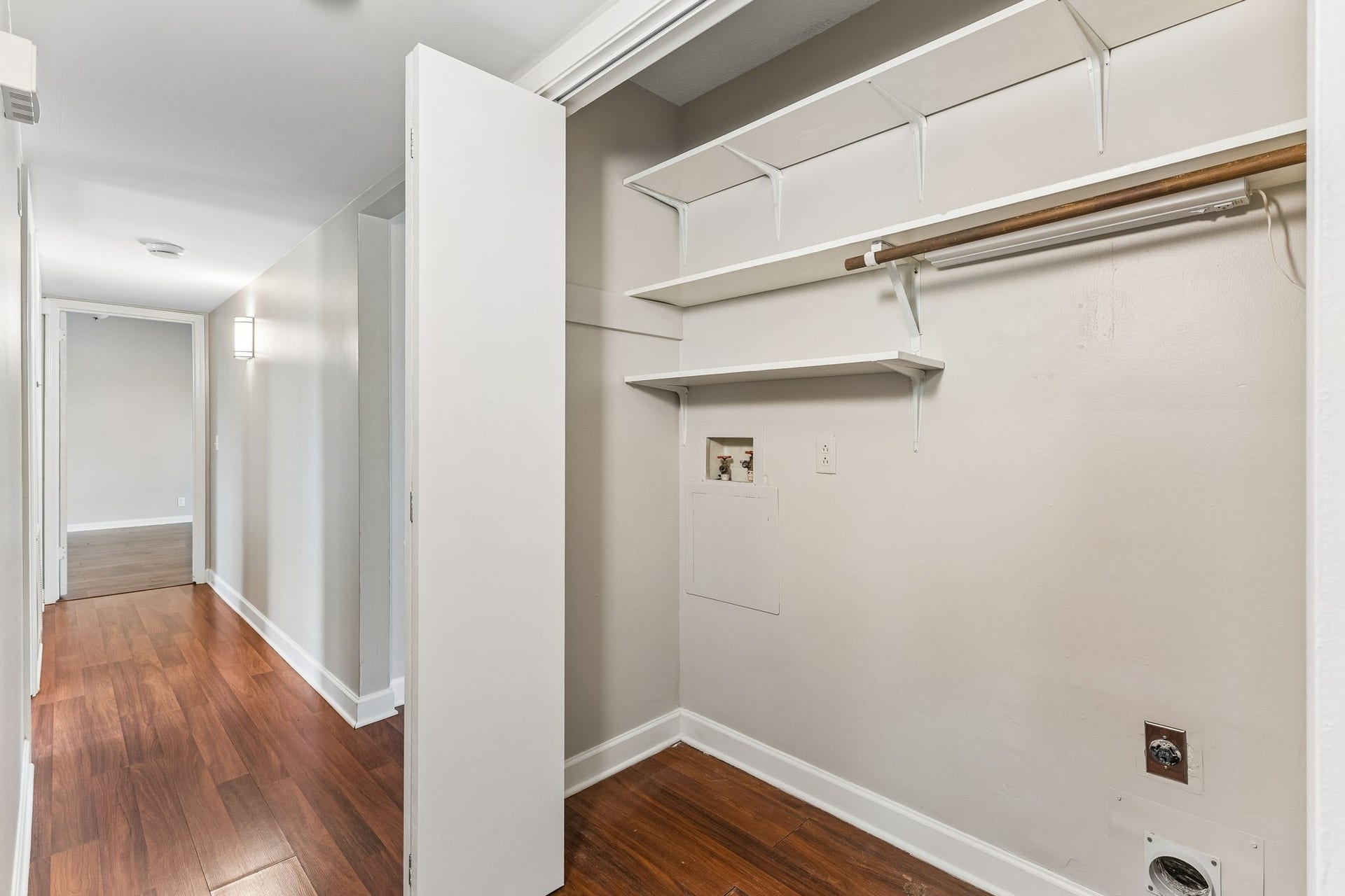 Just across from the kitchen is  the laundry closet.