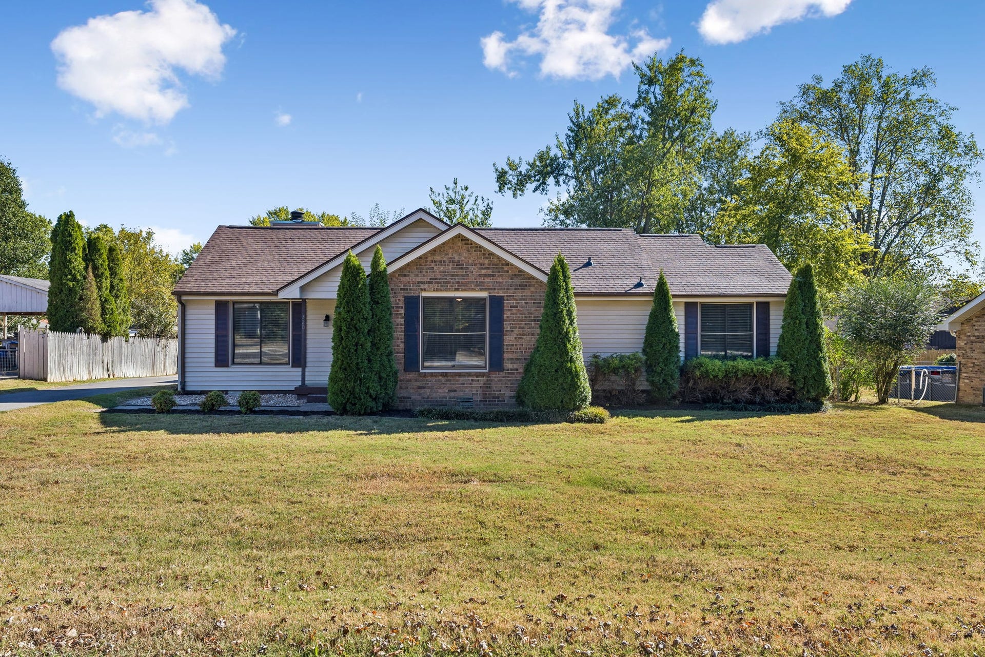 Mature manicured landscaping capped with a BRAND NEW ROOF!