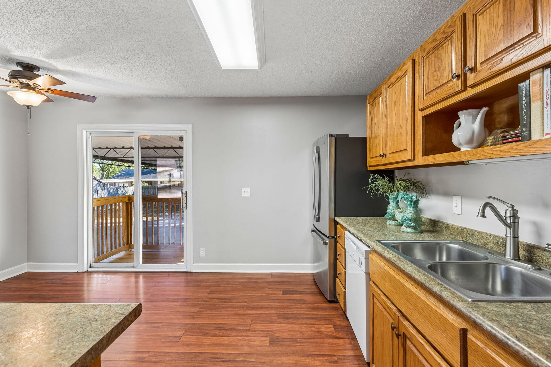 Easy access to the covered back porch & carport.