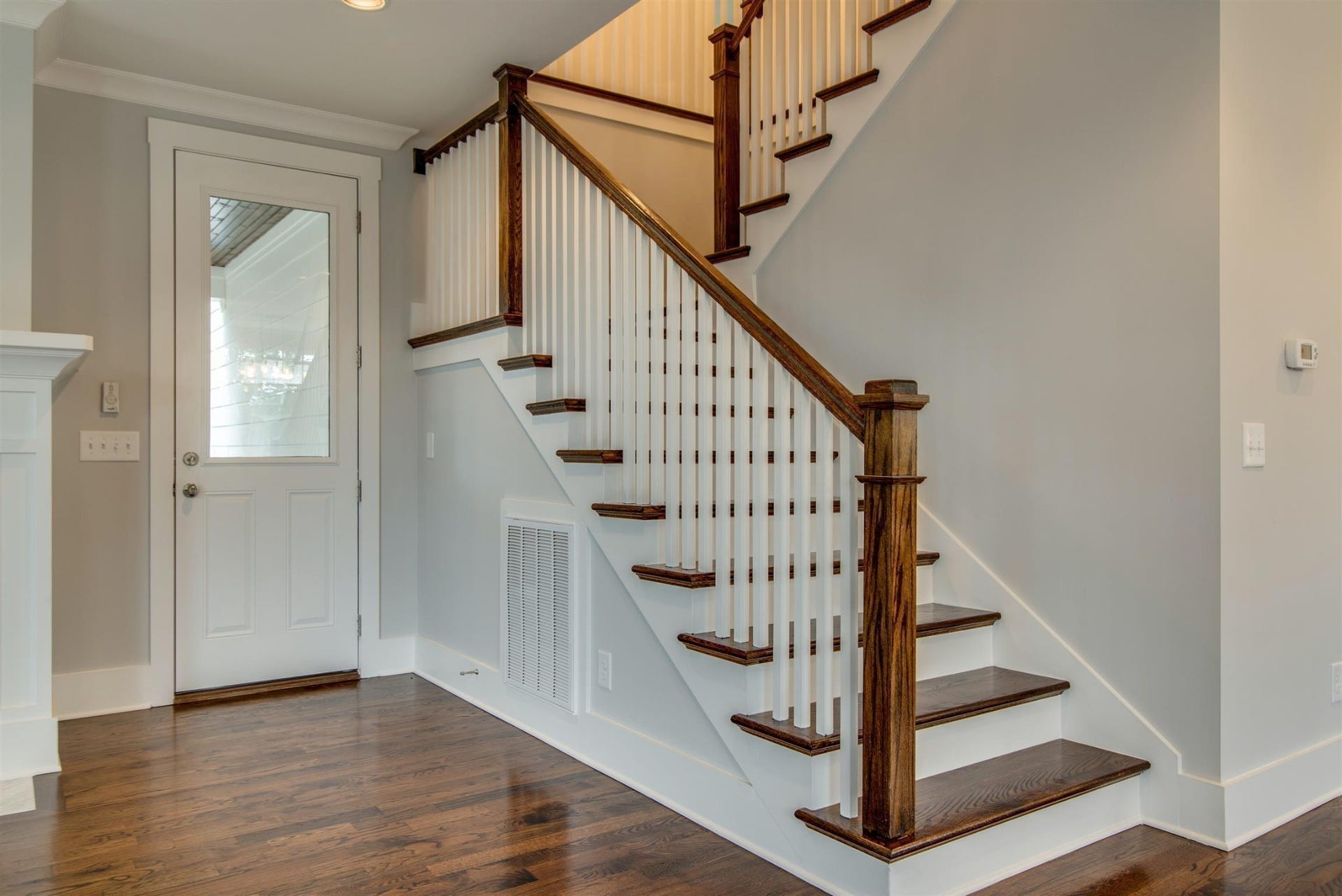 1711 10th Avenue S, Nashville, TN 37203 Staircase with hardwood steps.