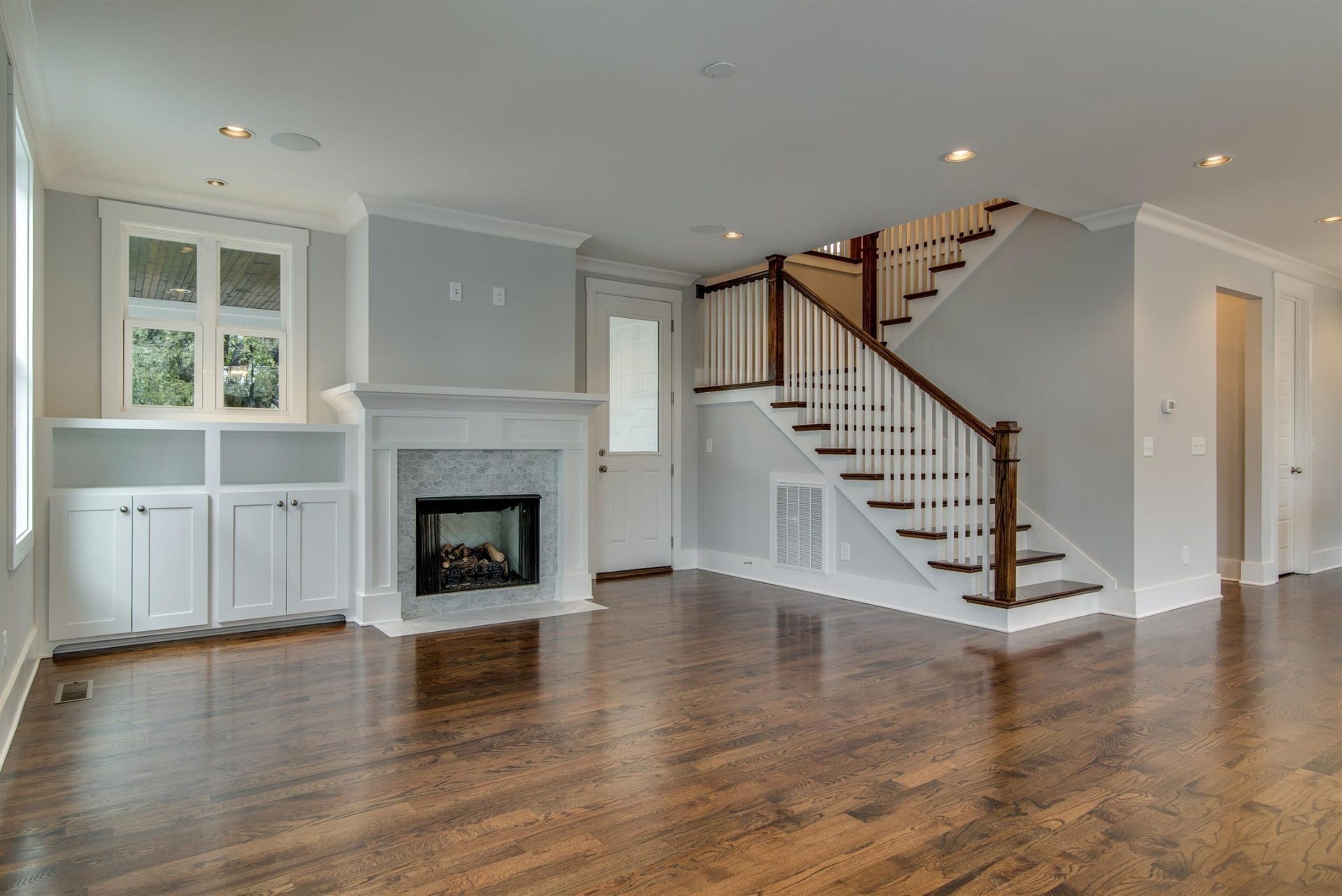 1711 10th Avenue S, Nashville, TN 37203 Living room with lots of windows, private covered deck.