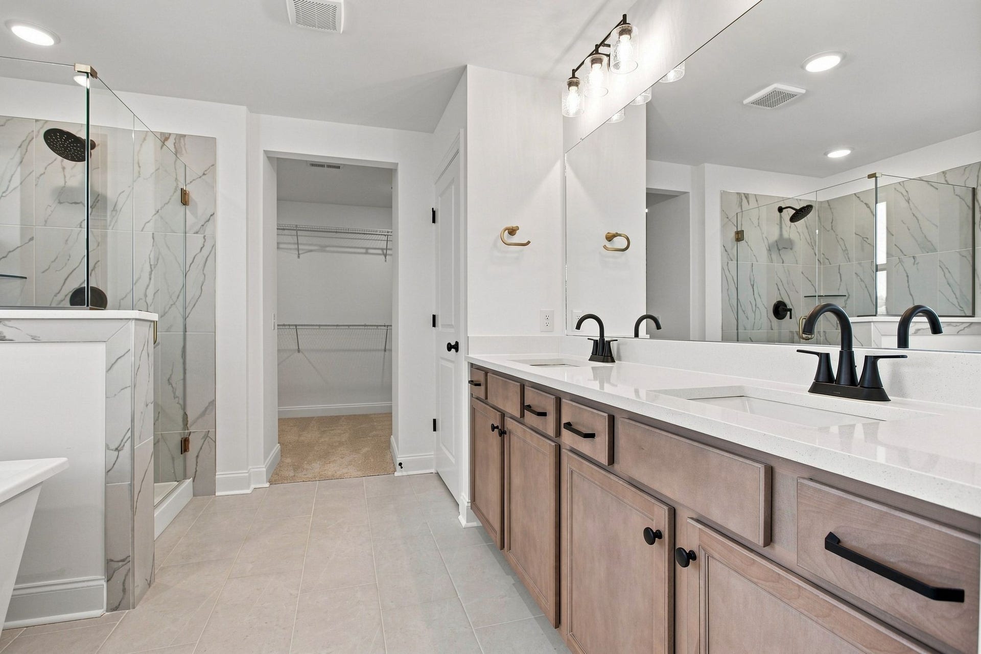 762 Caddy Xing, Columbia, TN 38401 Owner's bath with dual vanity, shower, stand-alone tub and walk in closet