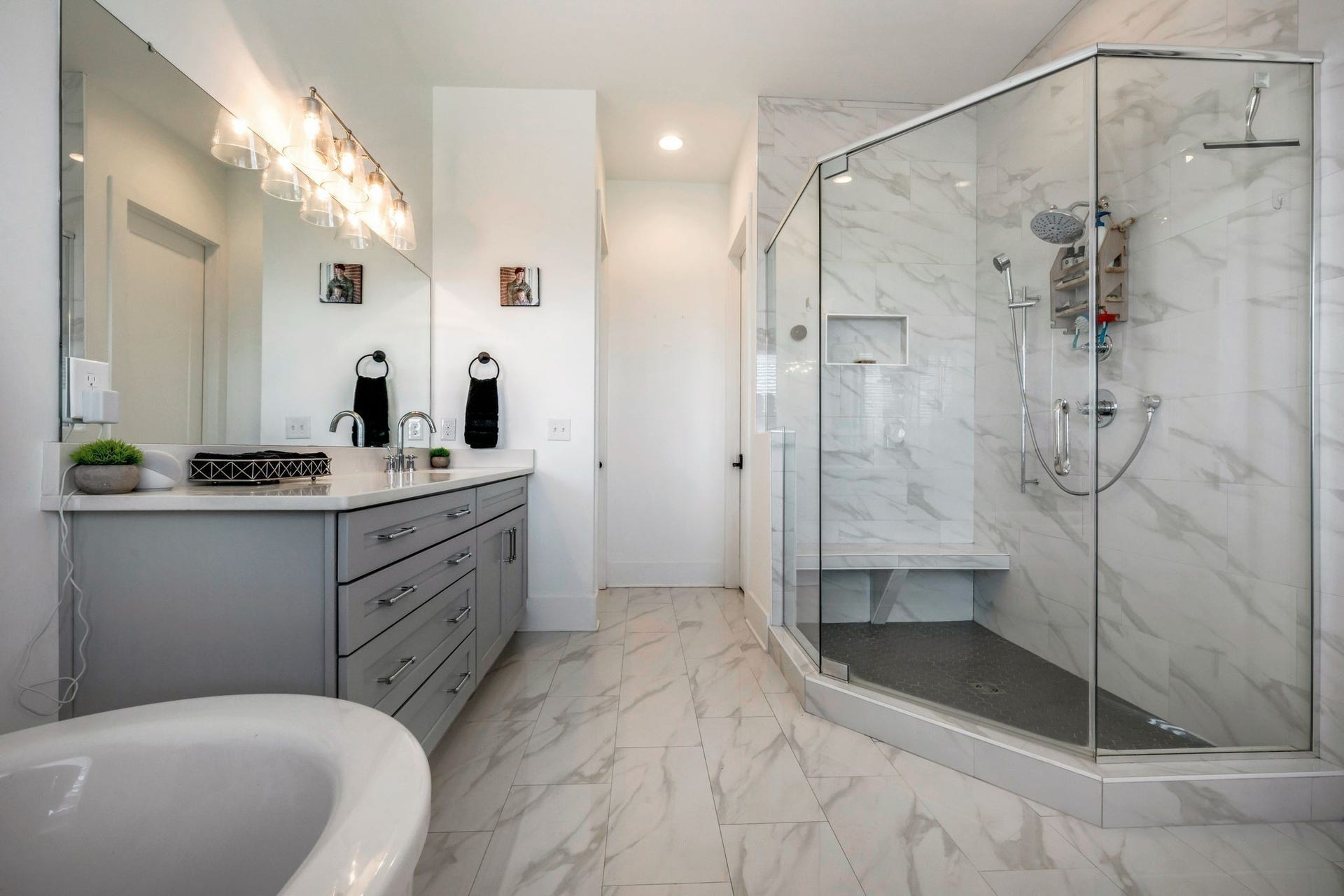 And you'll be ready to jump out of bed to indulge in this spa-like bath with oversized walk-in shower with seat bench, free standing soaking tub and 2 separate vanities.  Linen closet and private WC.
