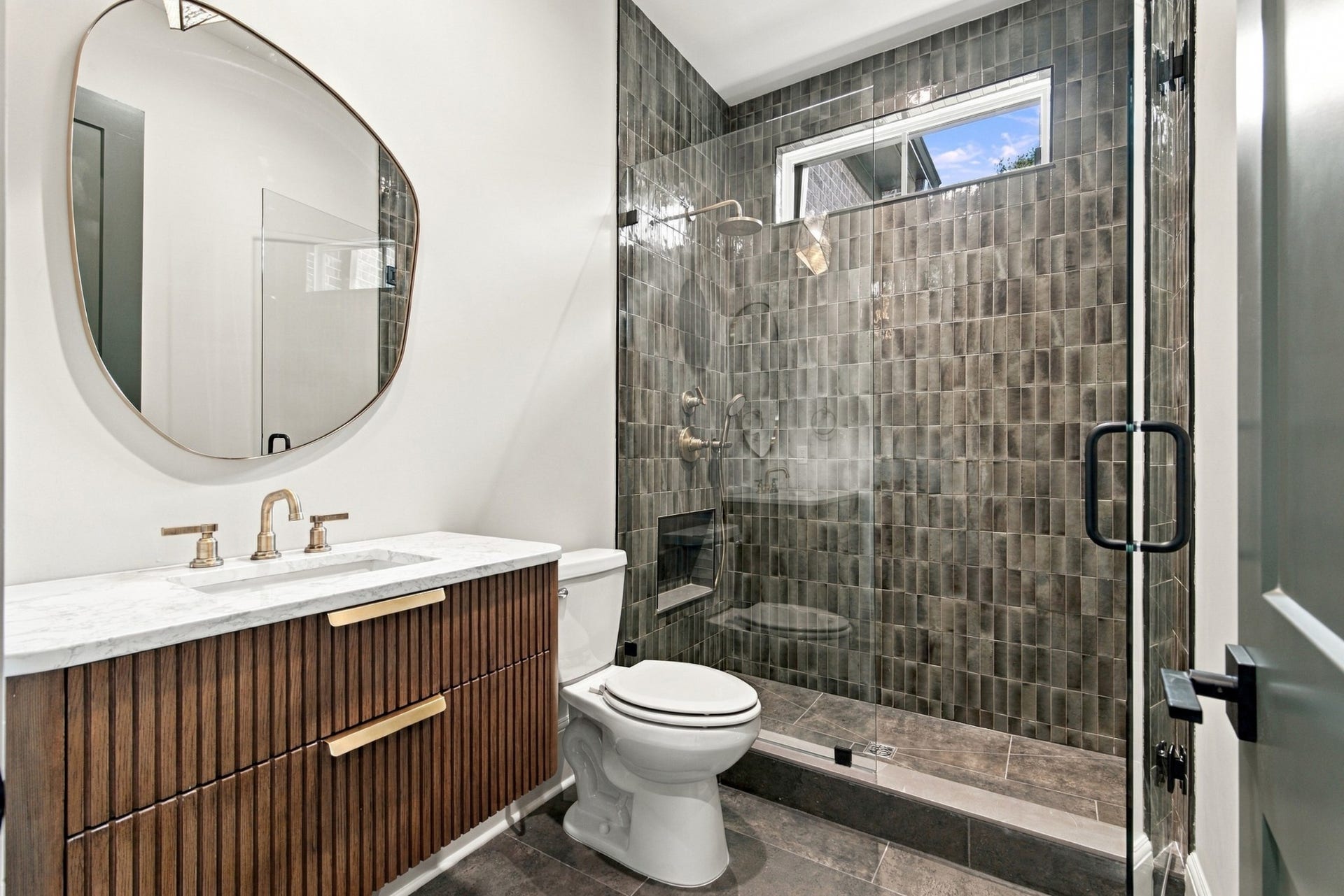 1001 Wright Branch Ct, Mount Juliet, TN 37122 This guest bath is just off the side entry making it convenient for your guests. Notice the beautiful tile and floating vanity