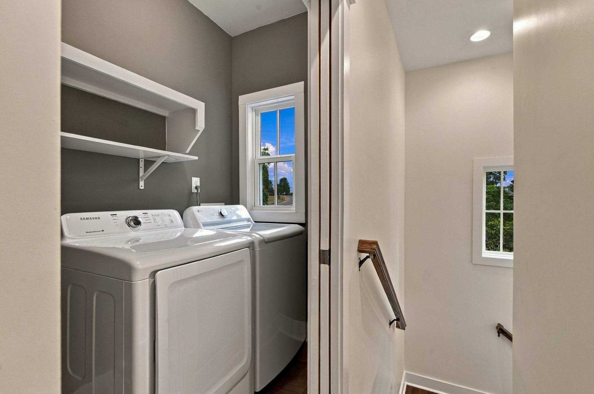 laundry room on upper level with a convenient pocket door. Washer and dryer convey.