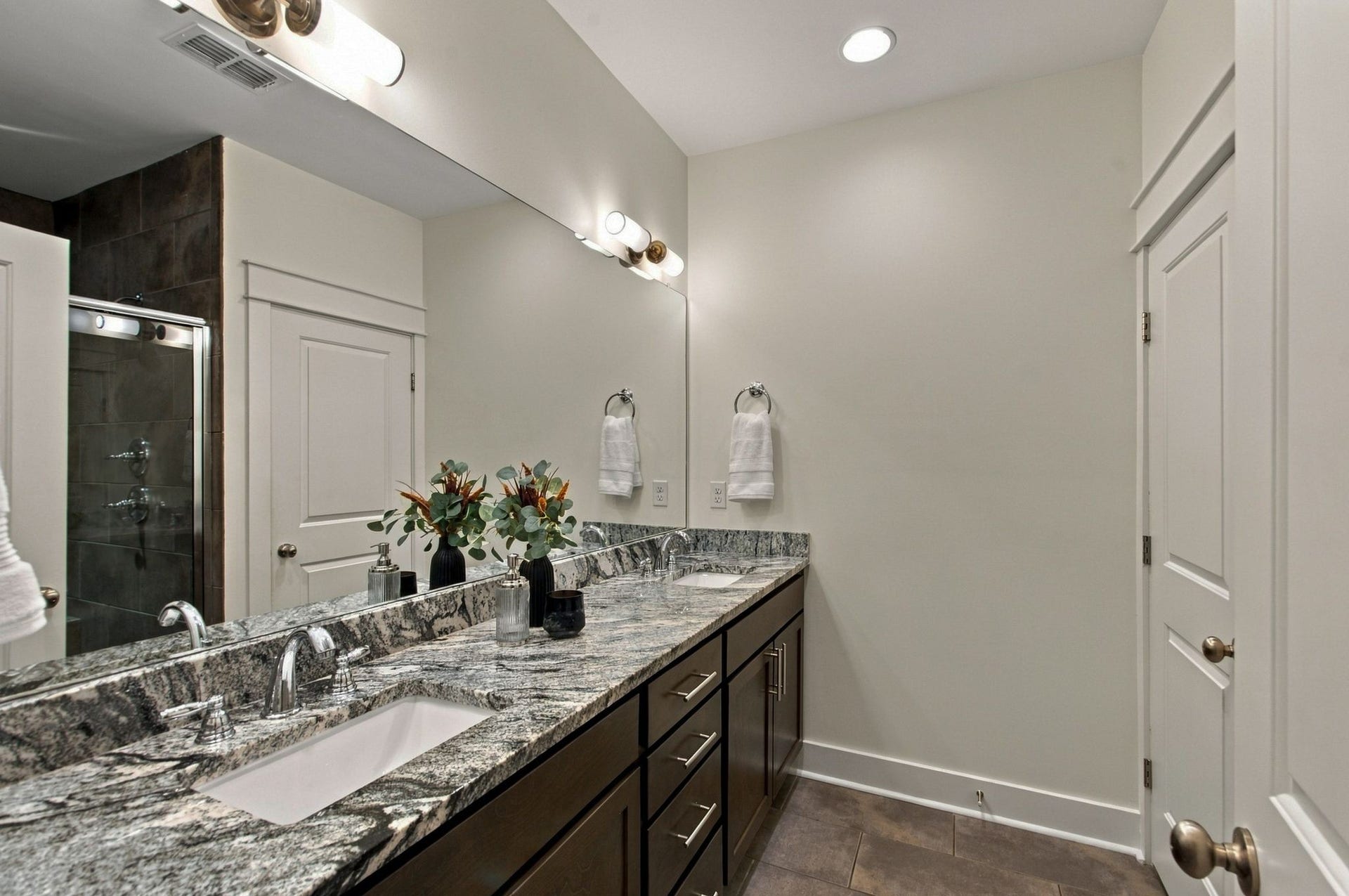 The primary bath features a double vanity with great storage