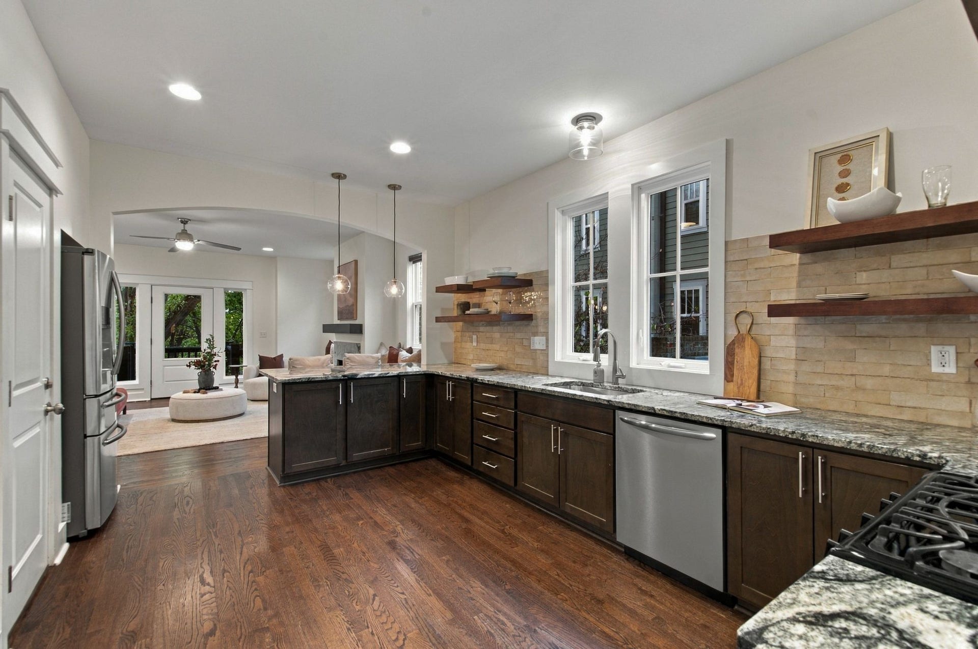Another view of the kitchen looking onto the living room. The door to the left is to the garage.
