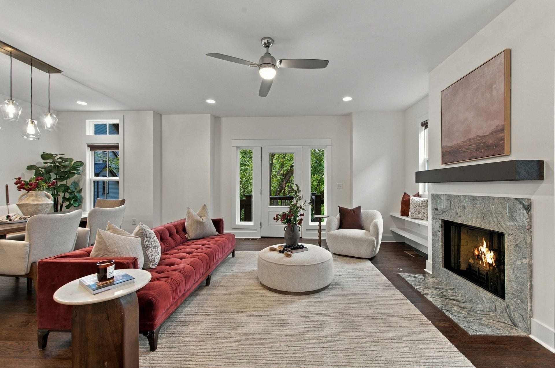 Spacious and bight living room centered on the fireplace