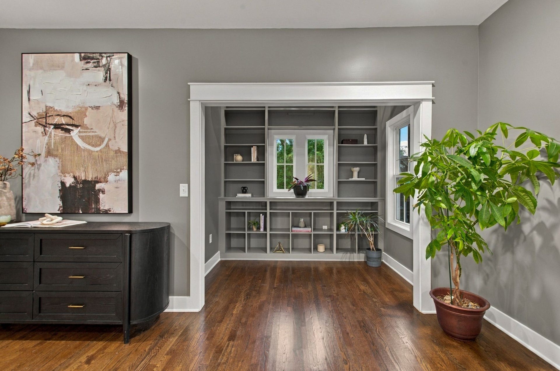 Library off the primary bedroom that can be used to display your favorite books and artifacts. A perfect spot to curl up with your favorite book or get on your laptop while enjoying the great view of the common green space.