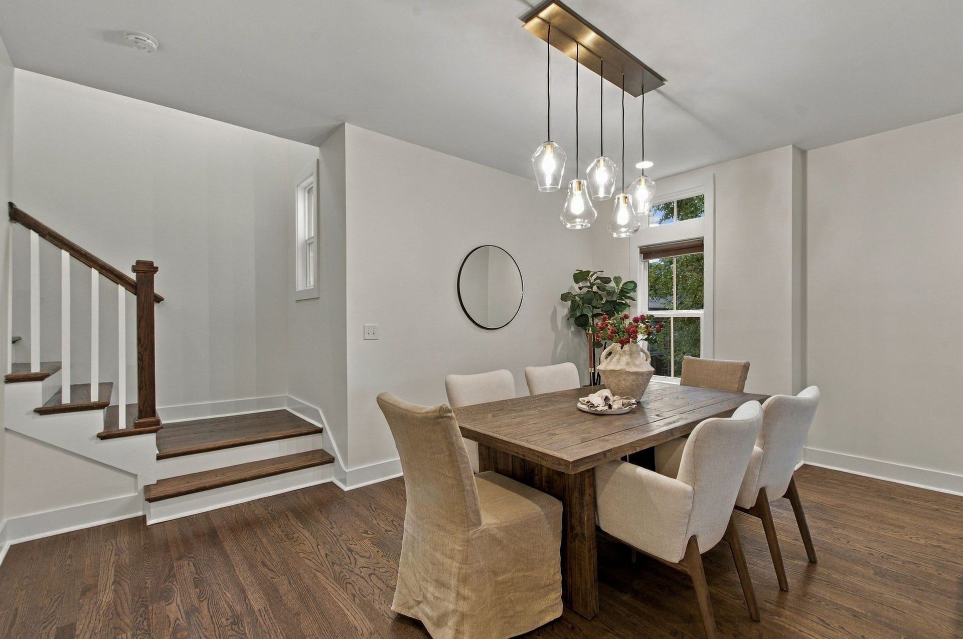 The dining area is sun-kissed and offers great views of the lush green space