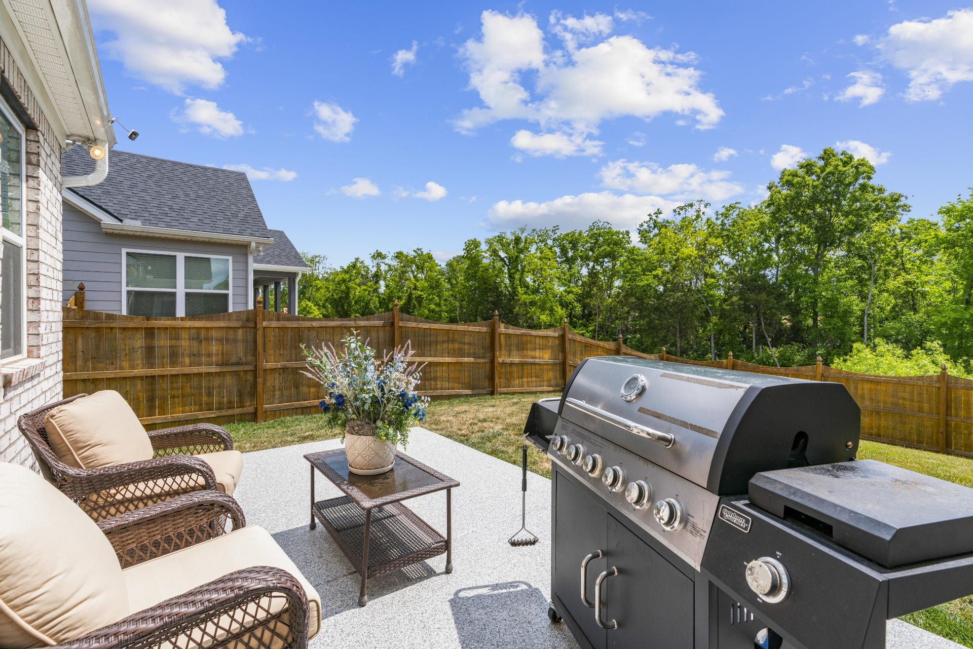 413 Mabels Way, Mount Juliet, TN 37122 The fenced backyard offers privacy, usable outdoor space and a beautiful view of the adjoining greenspace.