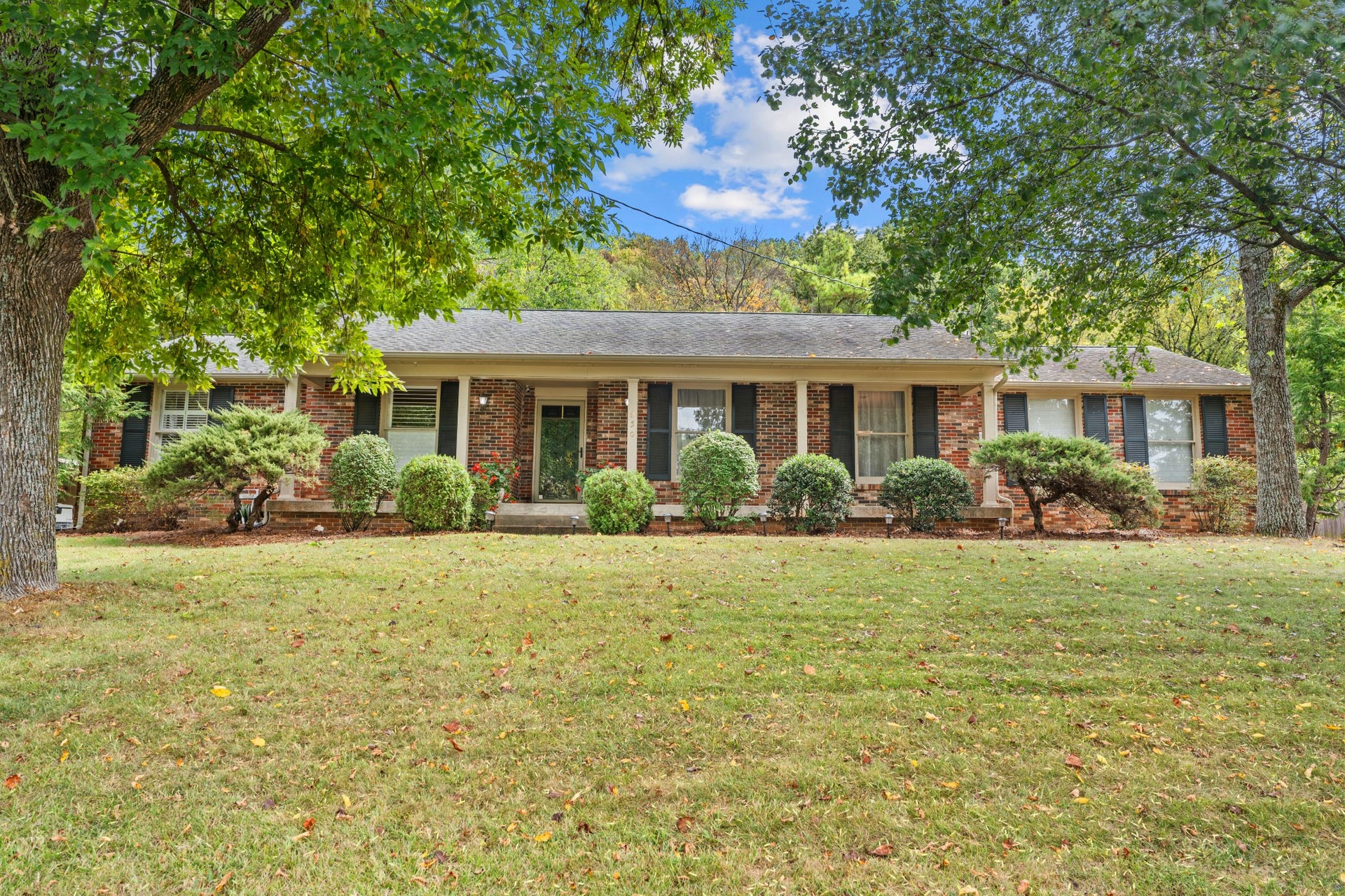 930 Percy Warner Blvd, Nashville, TN 37205 Beautifully cared-for, one-level brick home nestled between Belle Meade and Warner Parks.