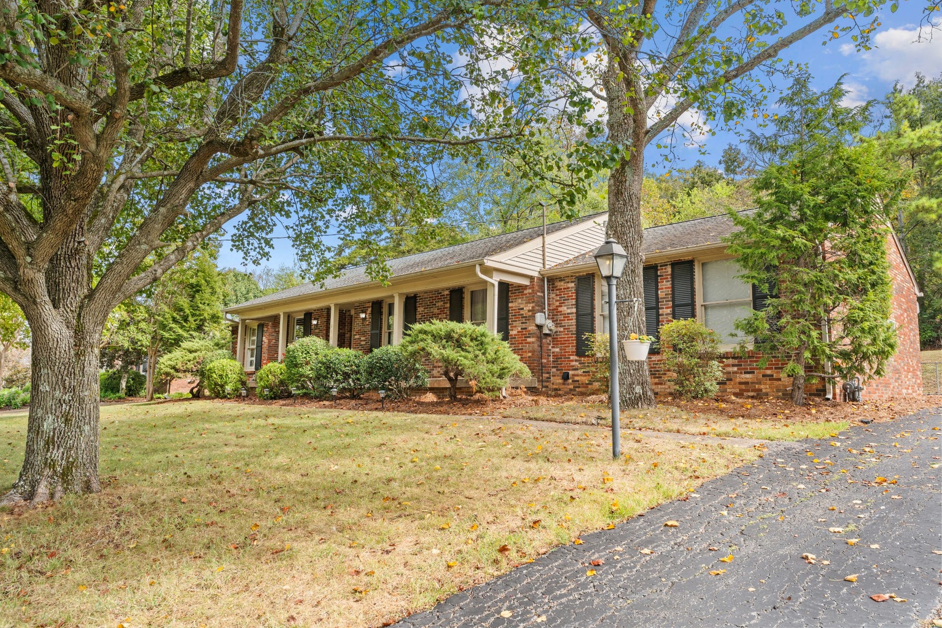 930 Percy Warner Blvd, Nashville, TN 37205 Mature trees and Rocking Chair Front porch