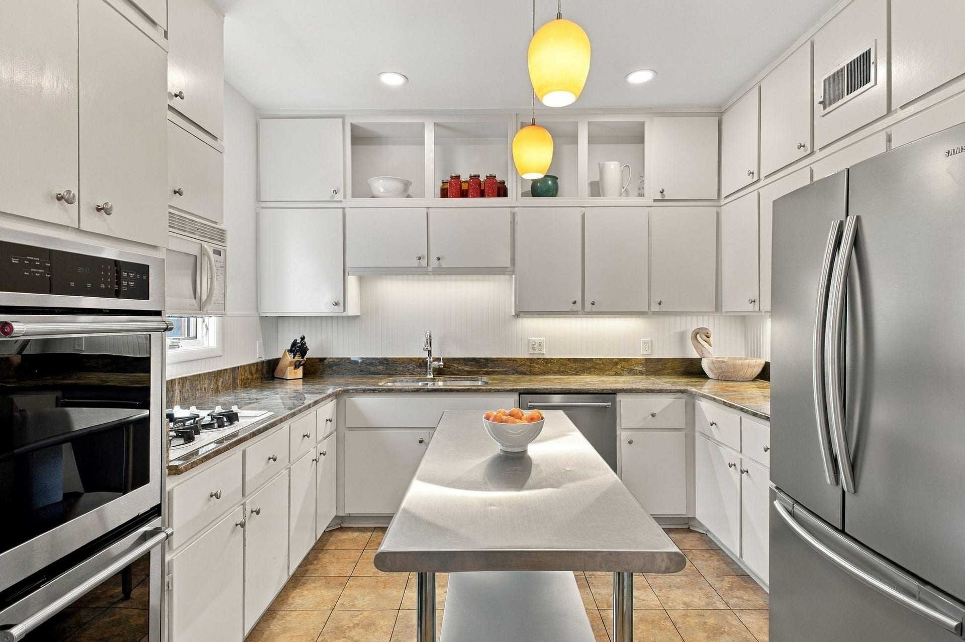 Kitchen with double ovens, gas range and abundant cabinetry