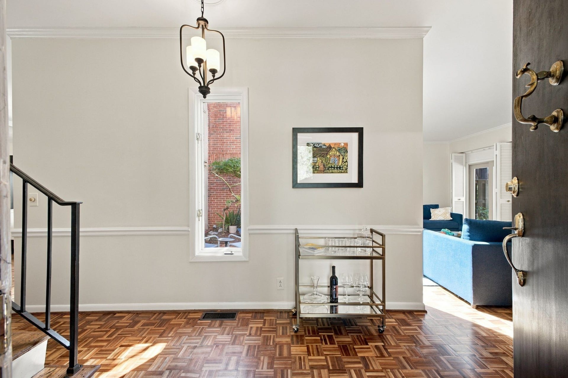 Light-filled Foyer with hardwood floors