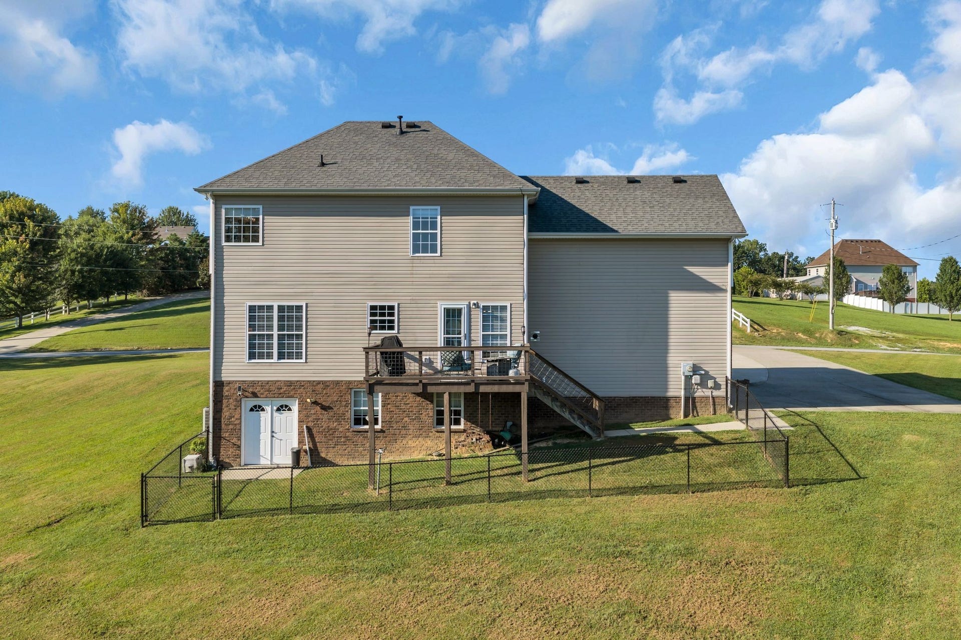 170 Lena Loop, Burns, TN 37029 Fenced in area, deck built with Trex all overlooking the pond (belongs to the neighbor)