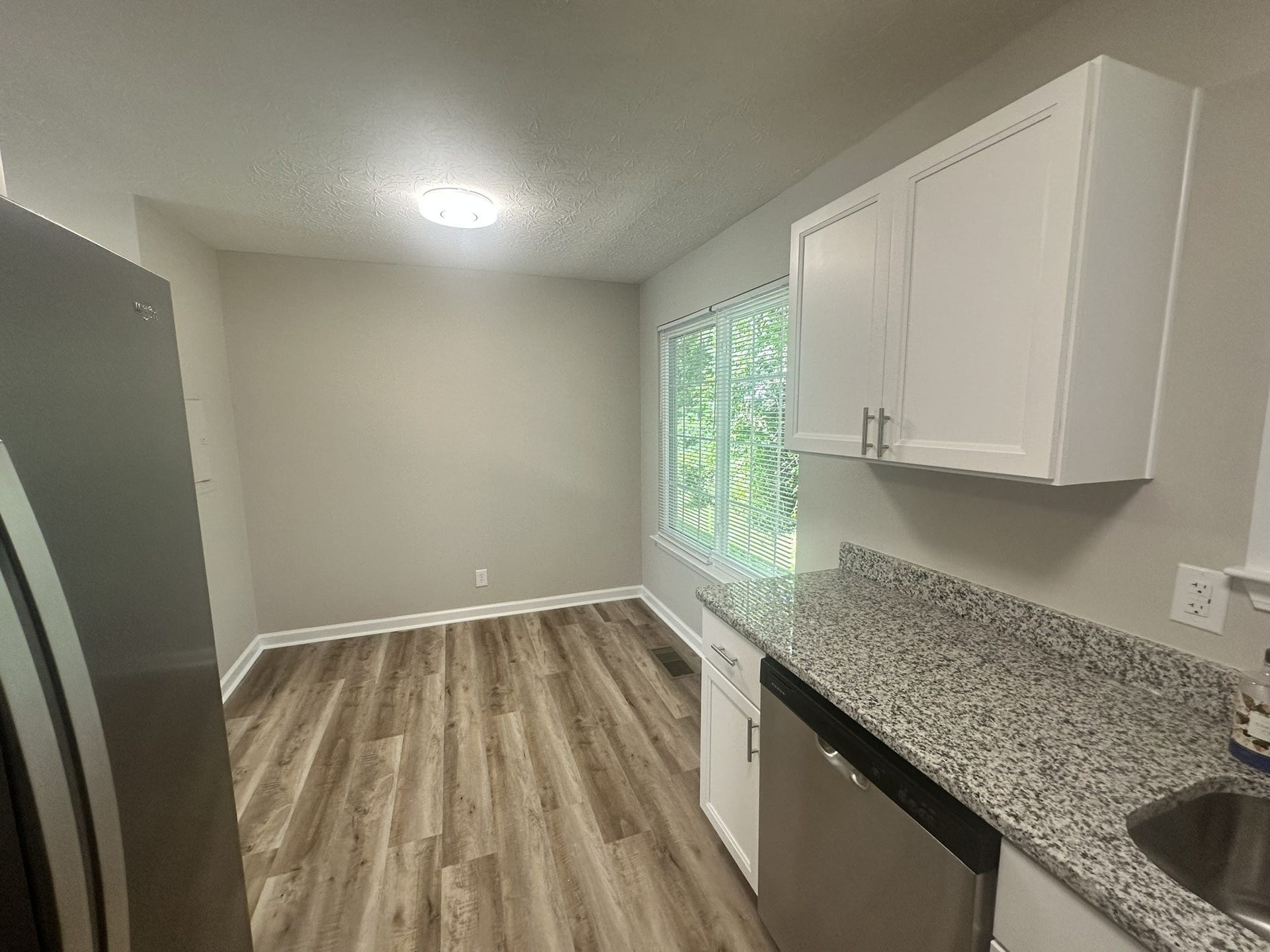 1506 Batts Blvd, #5, Springfield, TN 37172 Perfect Dining Space: Perfect for hosting dinner parties or casual meals in this bright dining area, seamlessly connecting to the kitchen for easy serving.