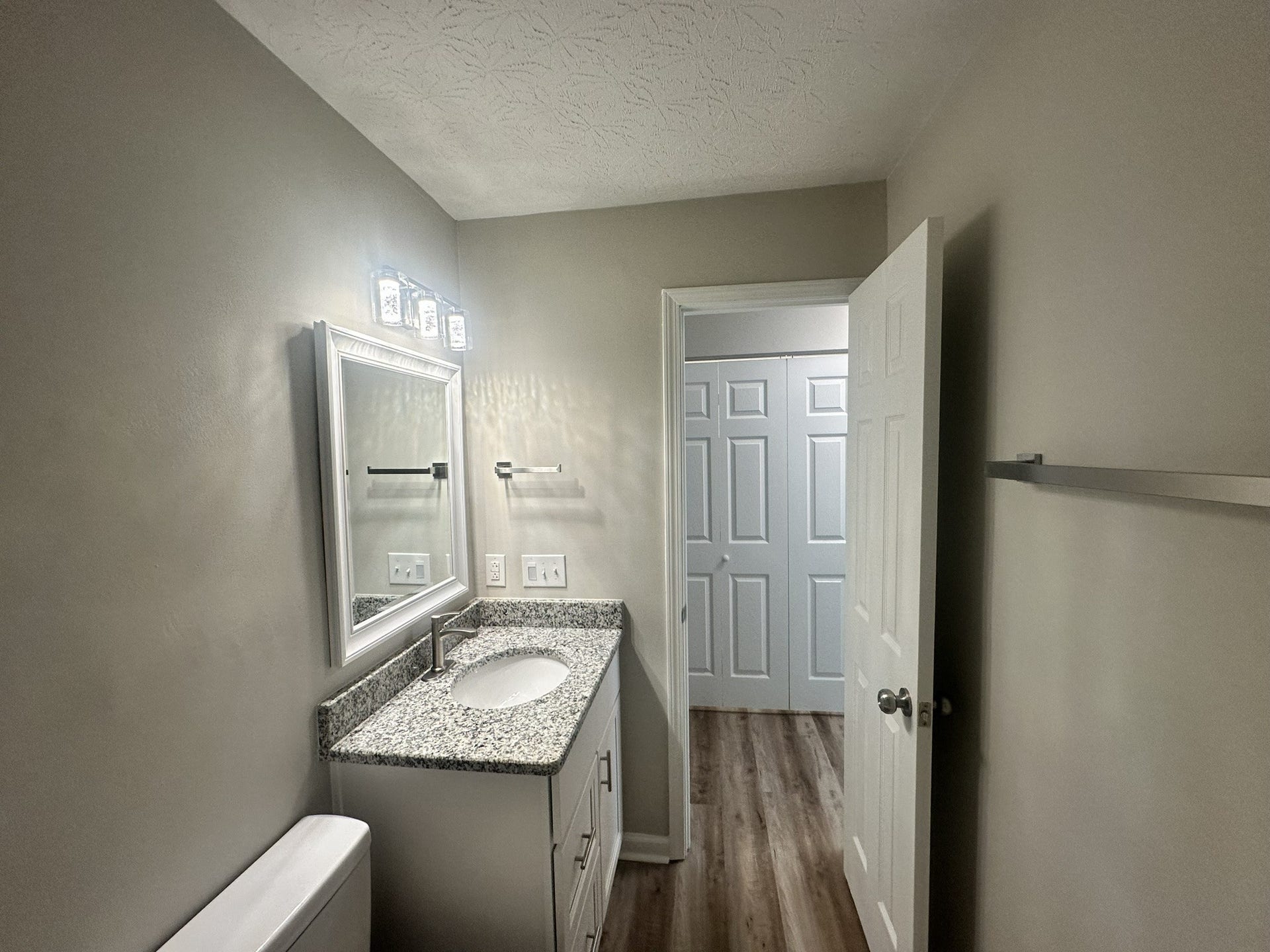 1506 Batts Blvd, #5, Springfield, TN 37172 Everyday Comfort: Start your day refreshed and relaxed in this updated bathroom. Enjoy granite countertops and soft-close real wood cabinets, with drawers and a storage cupboard, it's a practical space. We even added a nightlight!