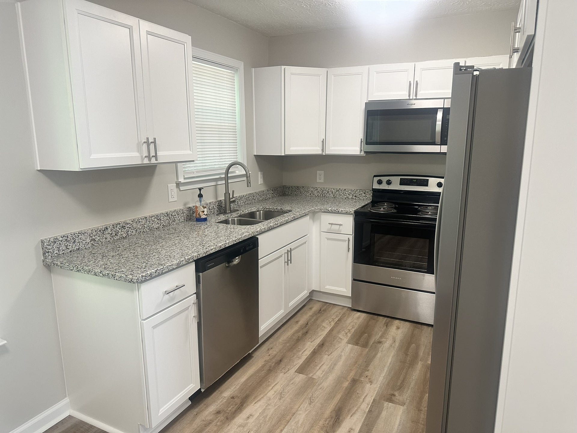 1506 Batts Blvd, #5, Springfield, TN 37172 Practical and Attractive: The kitchen features granite countertops and real wood soft-close cabinets, making it both functional and pleasant to use.