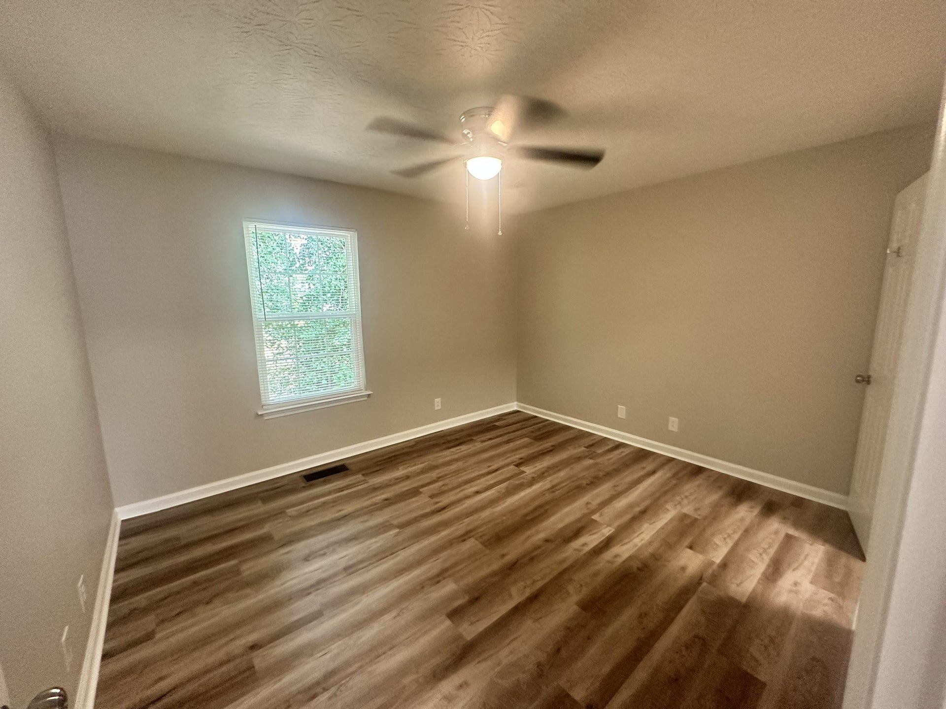 1506 Batts Blvd, #5, Springfield, TN 37172 Serene Sanctuary: Drift off to sleep in the spacious master bedroom with LED ceiling fan. The window looks out to the very private side yard, which is shaded. Pretty private, but you have room darkening blinds for added privacy.