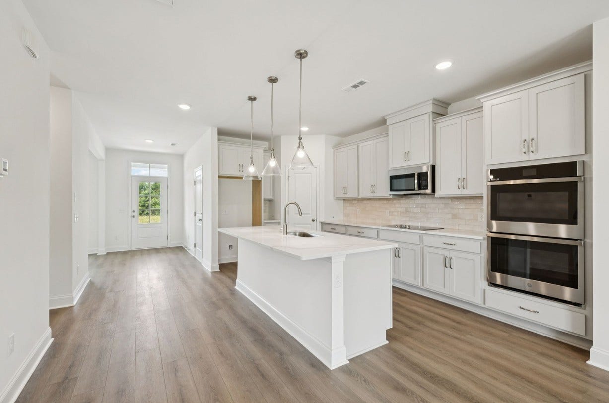 Macon kitchen. Photo is of similar home, same plan. Colors and options may vary.