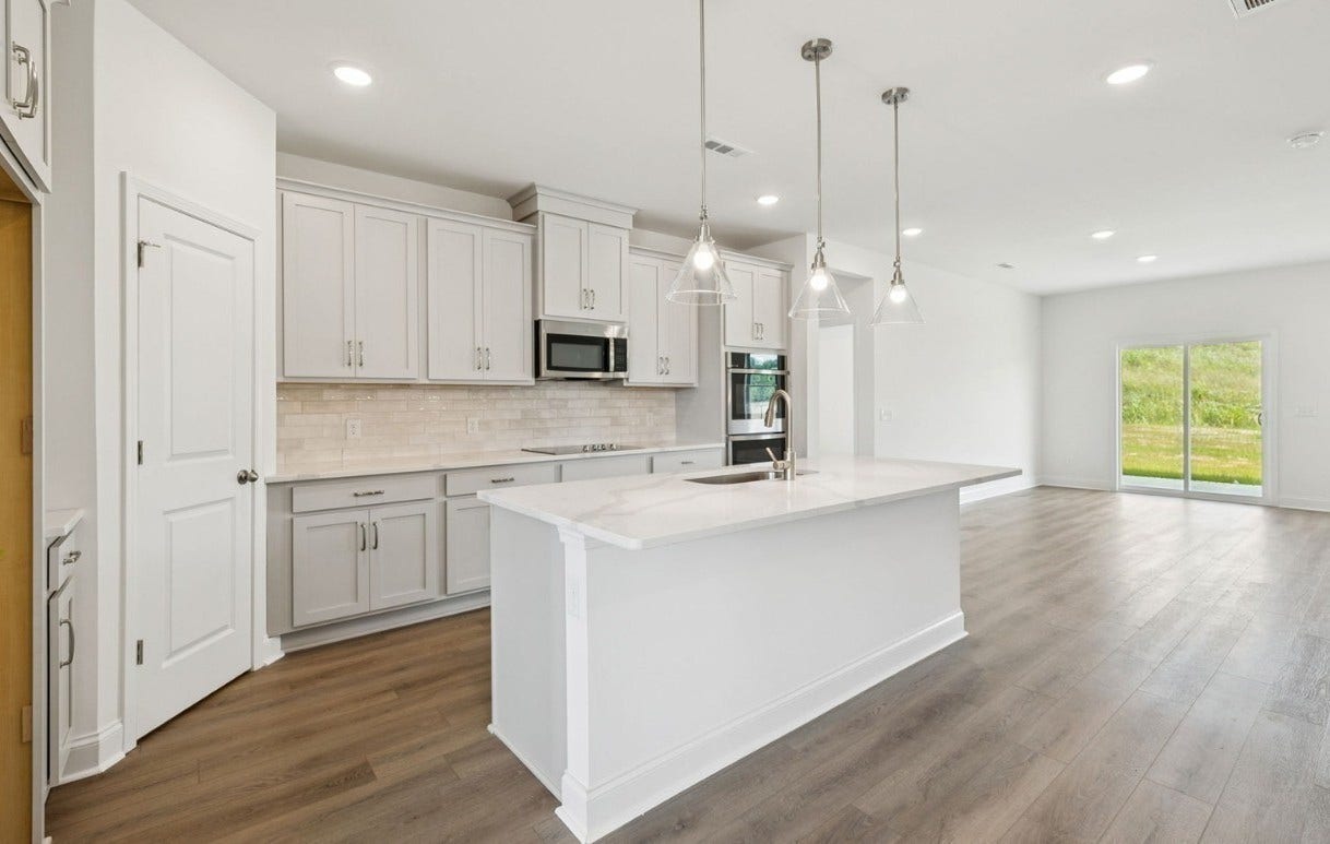 Macon kitchen. Photo is of similar home, same plan. Colors and options may vary.