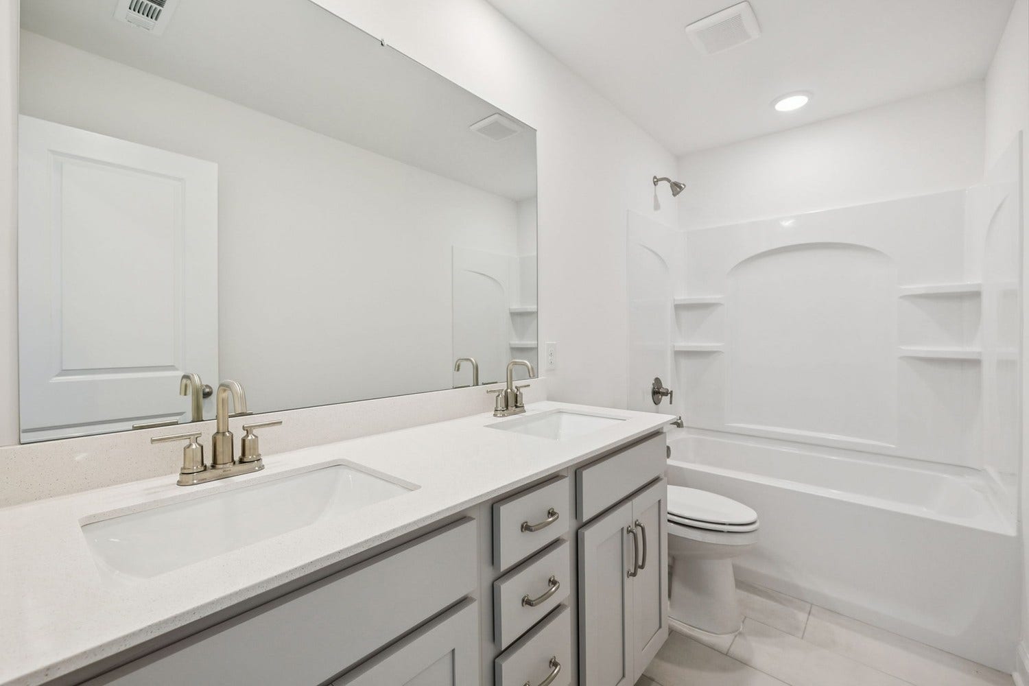 Macon guest bath. Photo is of similar home, same plan. Colors and options may vary.