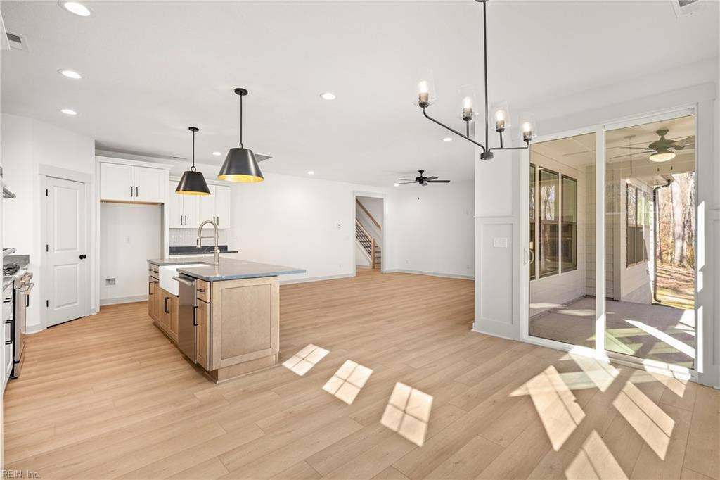 View of the Eat in Kitchen and Great Room from the dining area.