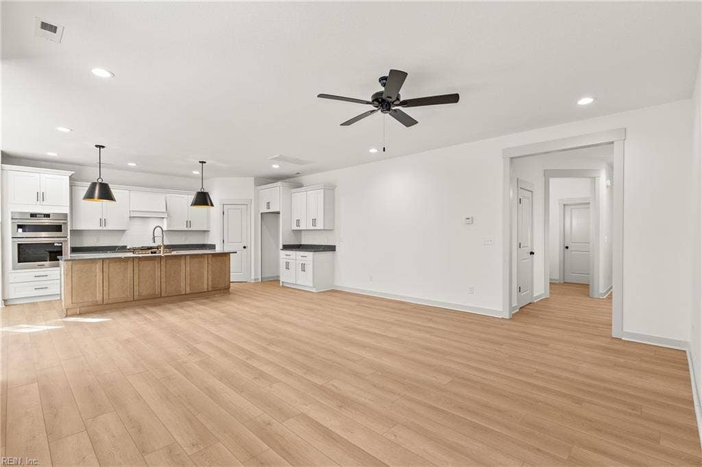View of the Great Room, Eat in Kitchen, and the Entryway.