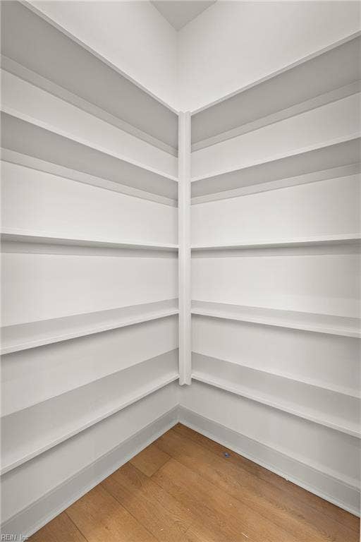 The Eat in Kitchen features a large walk in pantry with wood shelving.