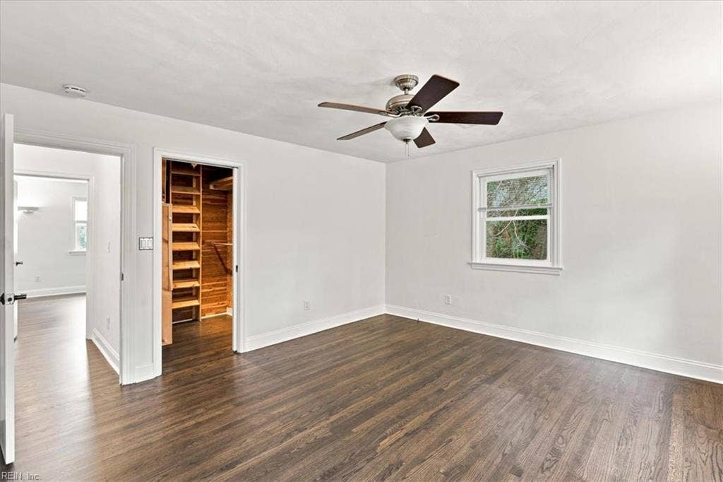 Cedar lined closet in primary bedroom with built in shelves.
