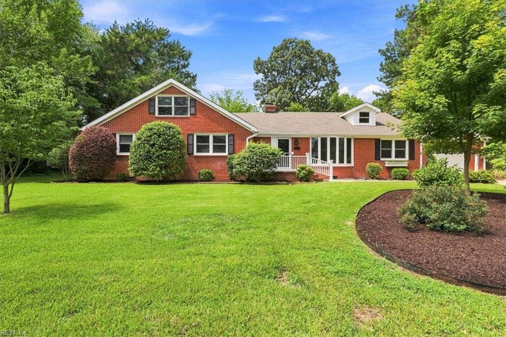 Lovely lakeview home on 1/2 acre lot in sought after Kings Grant