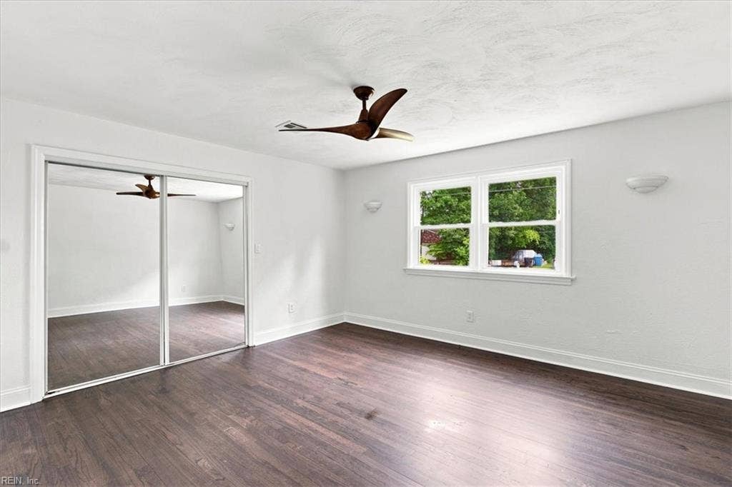 Bedroom 2 is also spacious with large closet, ceiling fan and hardwood floors.
