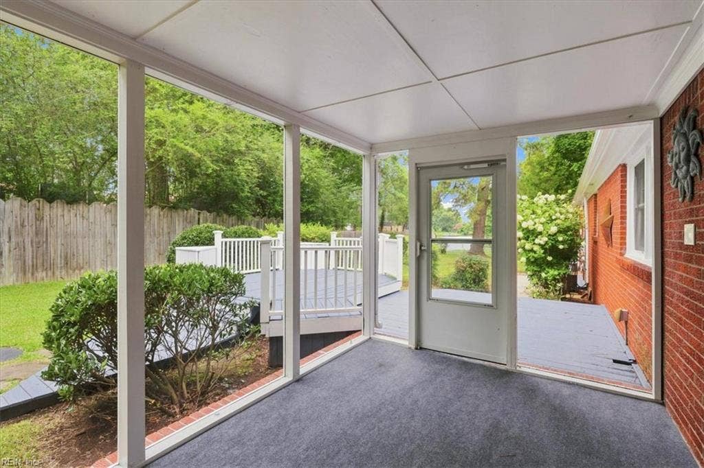 Enjoy fenced backyard from screened back porch or multi level deck