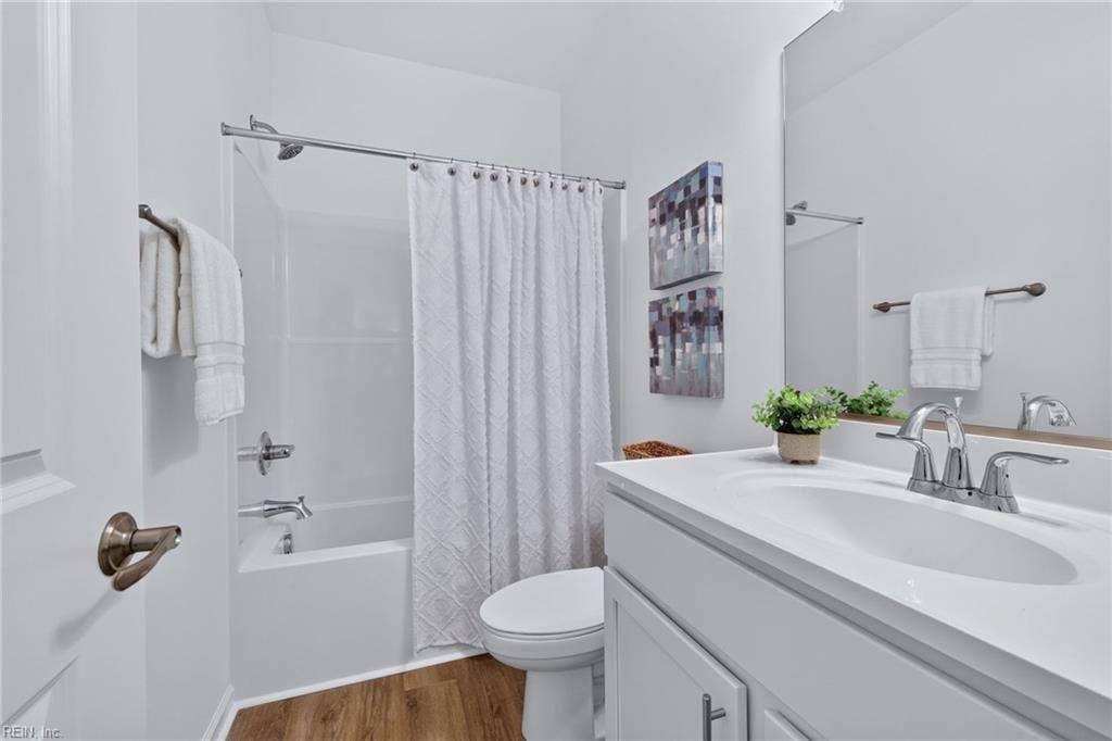 Bedroom #1 attached full bathroom with tub/shower combo and LVP flooring