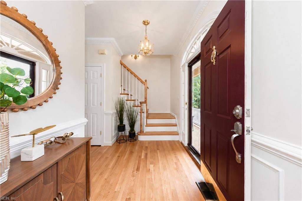 Welcoming Foyer with newly Refinished Hardwood Floors throughout!