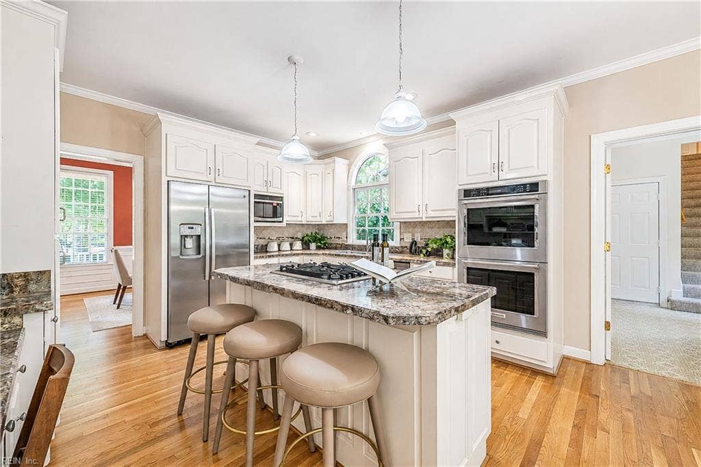 Kitchen Island offers additional seating. Pendant Lighting. All Appliances less than 3 yrs old