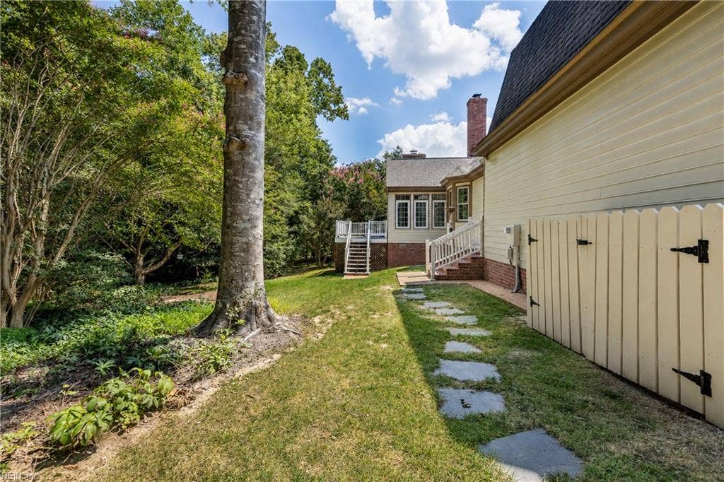 Path leads from Garage to Mud Room Entrance, Deck and Backyard.