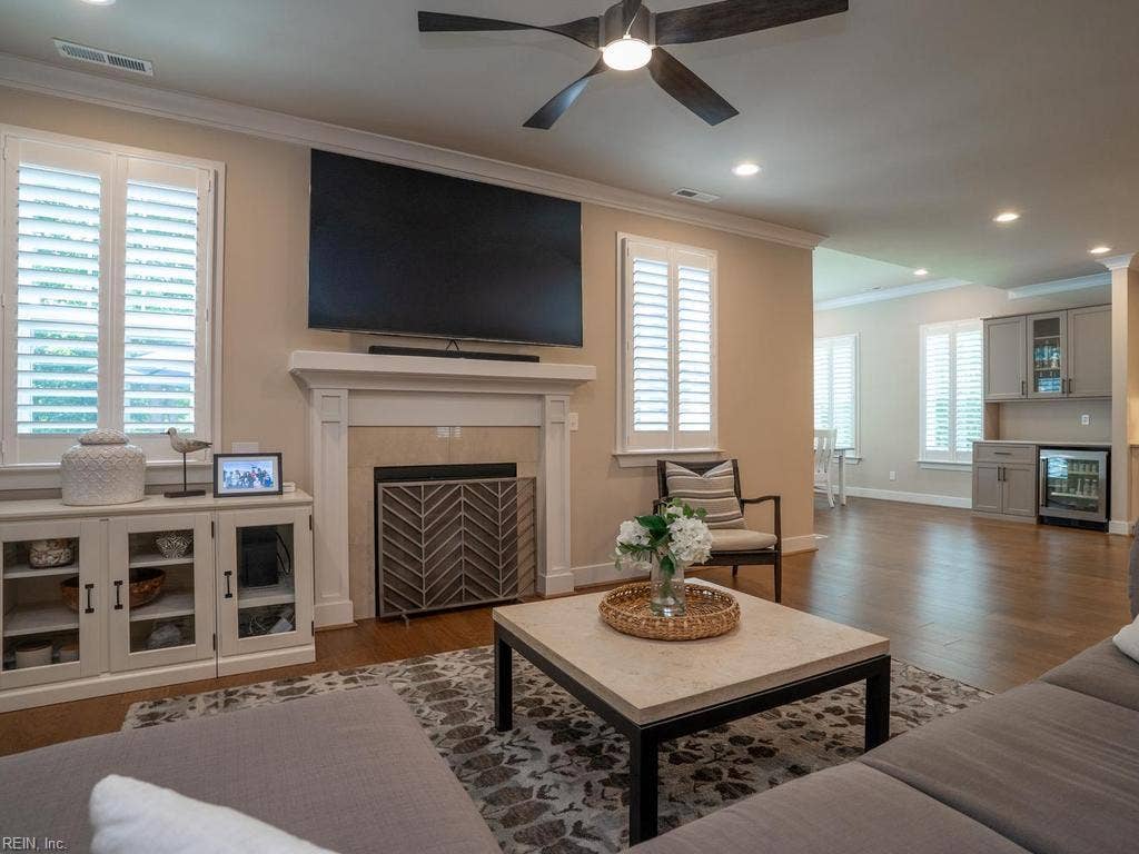 At the heart of the home is an expansive, open-concept living room and kitchen area, seamlessly designed for effortless everyday living and spectacular entertaining.